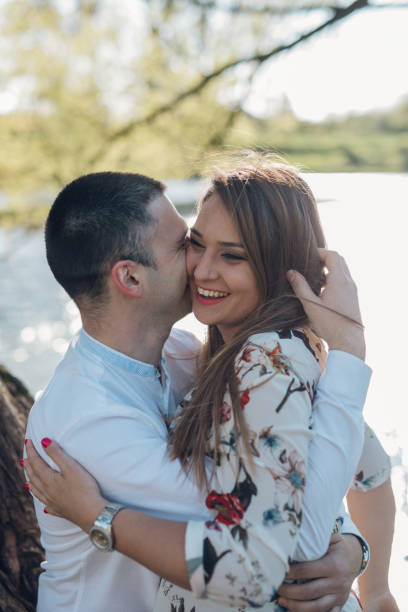 istock Young loving couple in the park 1144396058