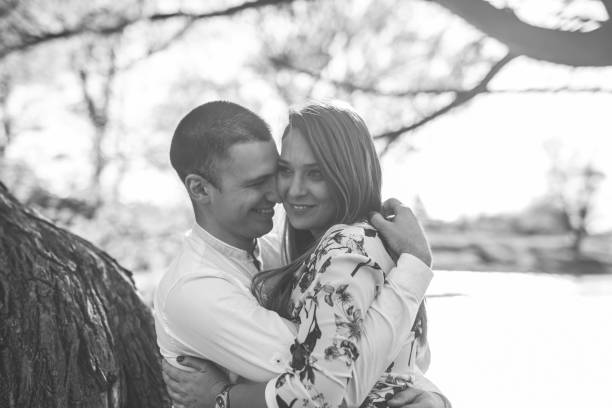 istock Young loving couple in the park 1144396135