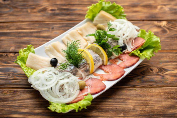 istock Various salted fish plate with herbs and lemon 1144396464