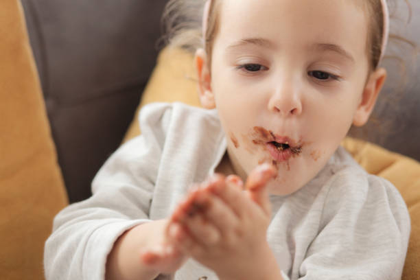 istock Smeared chocolate girl 1144397458