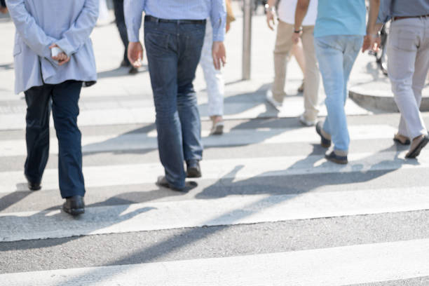 istock People walking on the pedestrian crossing 1144399013