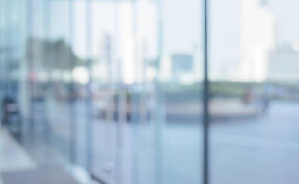 istock Blurred abstract glass wall from building in city town 1144399822