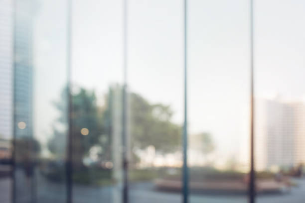 istock Blurred abstract glass wall from building in city town 1144399830
