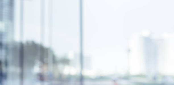 istock Blurred abstract glass wall from building in city town 1144399835