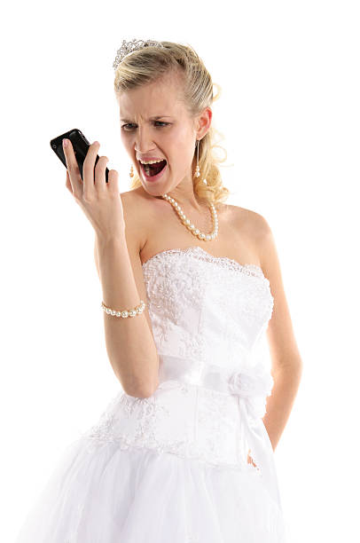 istock Dissatisfied bride with mobile phone 114440181