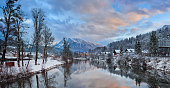 Scenic picture-postcard landscape with lake Traun, forest and mountains at evening in Austrian Alps. Beautiful view in winter. Austria, Bad Goisern