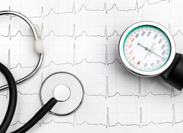 istock Stethoscope with manometer for measuring blood pressure on cardiogram. Top view. 1144402931