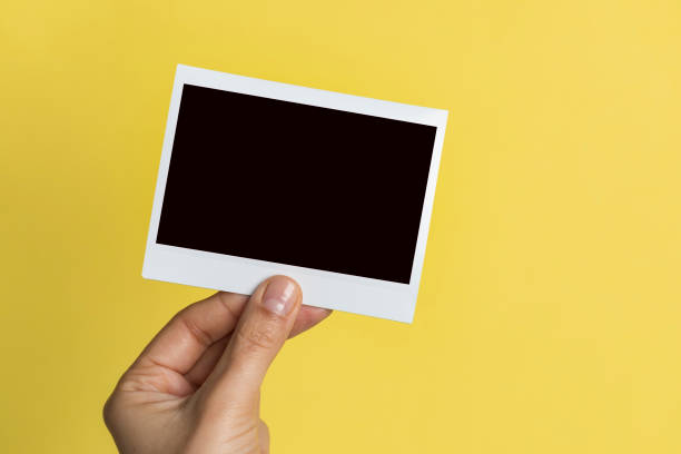istock Hand Holding Instant Photo 1144403866
