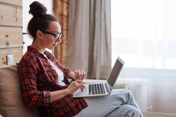 istock Girl working at home 1144404417