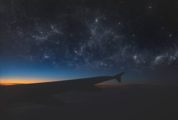 I took this photo wile traveling from paris to venice. The stars were added later on post. I exposed to the sunrise so the wing plane is in the shadow.