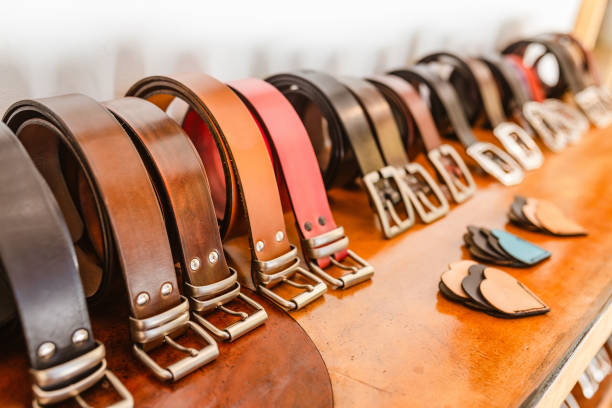 Handmade Leather Belts for sale in a stand of the crafts market Handmade Leather Belts for sale in a stand of the crafts market belt leather isolated close up stock pictures, royalty-free photos & images