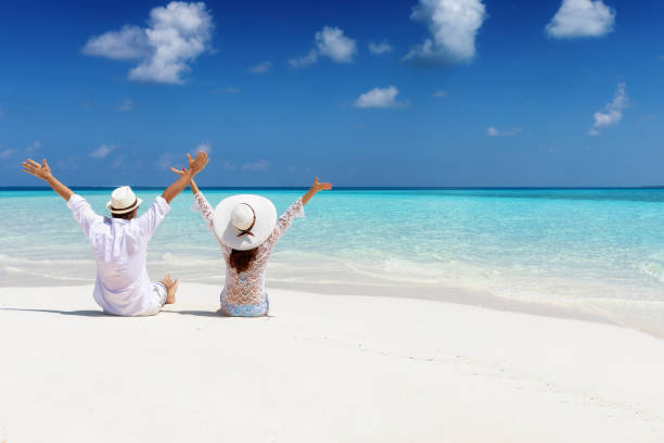 istock Honeymoon couple enjoys their vacation time on a tropical beach 1144407632