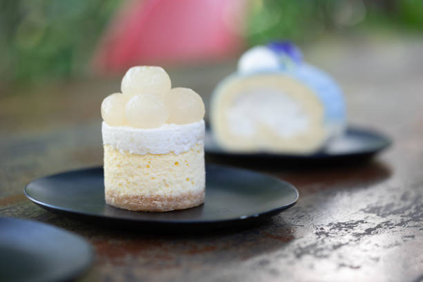 Longan cheesecake on the wooden table, dessert background.