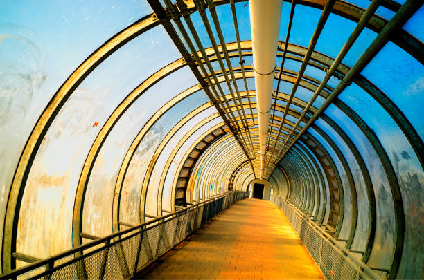 istock Dramatic industrial tunnel city background hd 1144408592