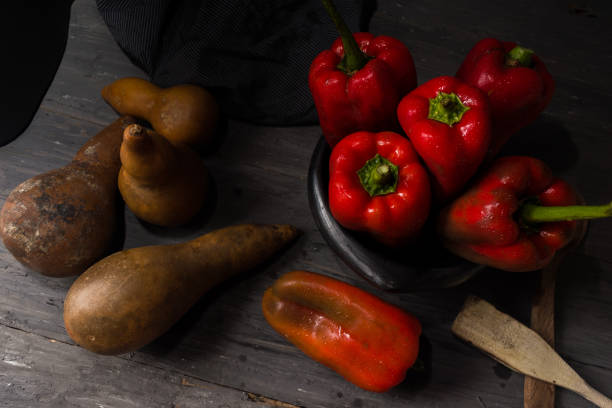 istock STILL LIFE WITH OVERHEAD VIEW OF RED PEPPERS ON A RUSTIC WOODEN TABLE 1144409617