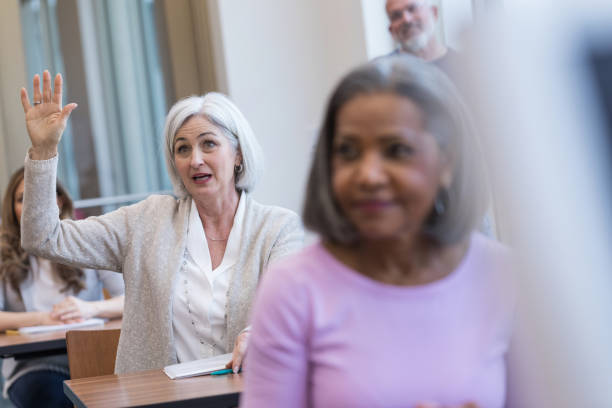 istock Serious woman asks question during meeting 1144410699