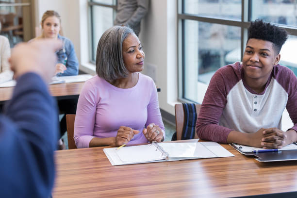istock Unrecognizable principal points at teenage boy during conference 1144410710