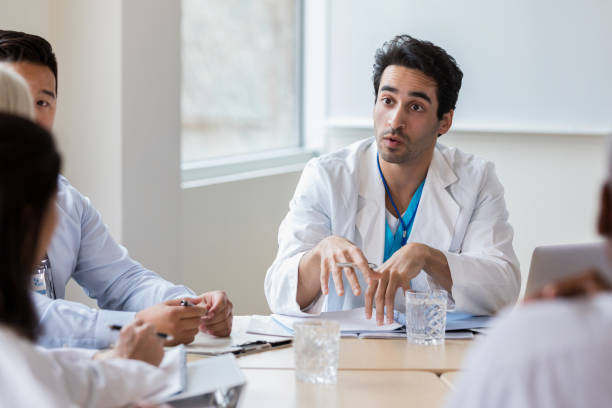 istock A mixed race doctor is serious about patient needs 1144410933