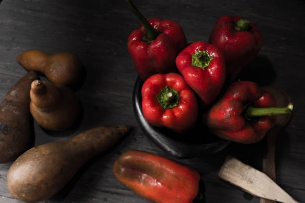 istock STILL LIFE WITH OVERHEAD VIEW OF RED PEPPERS ON A RUSTIC WOODEN TABLE 1144411121