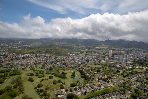 Aerial of downtown Honolulu, Hawaii. Showing buildings, homes and golf course.\n\nHonolulu, Hawaii, Oahu, United States - April 2018