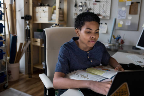 teenage boy studies for science test - biological culture imagens e fotografias de stock