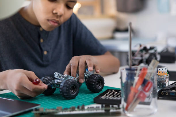 istock Boy building a robotic vehicle 1144411755