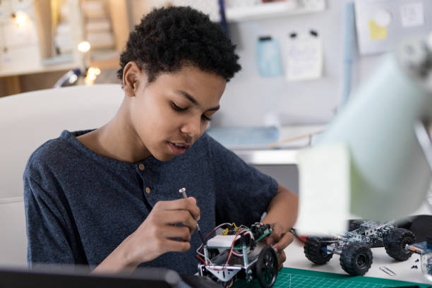 istock Boy builds robotic vehicle 1144411767
