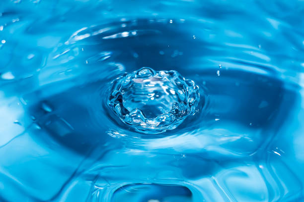 istock Water splash close-up. Drop of water. Blue water drop. Falling water. 1144411783