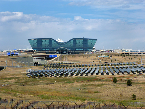 Fields of sun tracking solar panels produce electricity at the Jeppesen Terminal at the Denver International Airport and hotel in Colorado.
