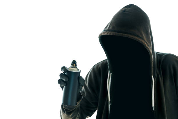 istock Hooded graffiti artist with spray paint can 1144416938