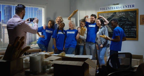 istock Volunteer team posing for group photo 1144417227