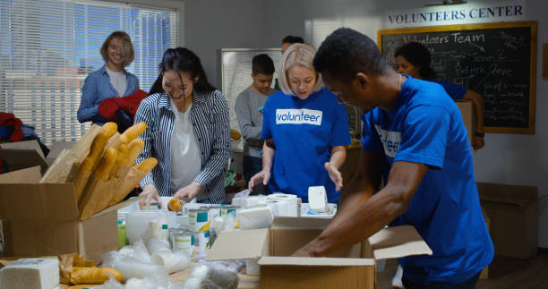 istock Volunteer team packing donated food 1144417784