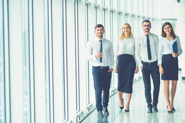 istock The business people walk in the office 1144419449