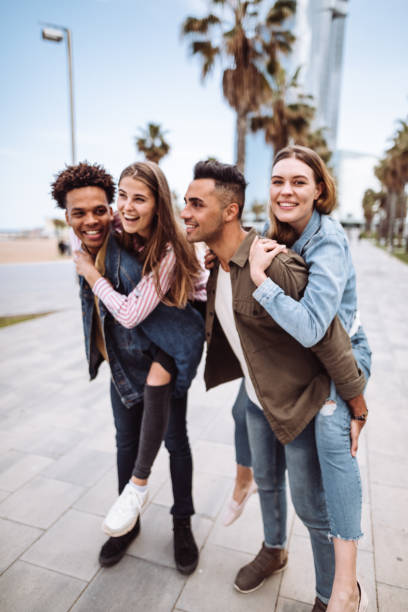 istock friends piggyback in barcelona 1144420467