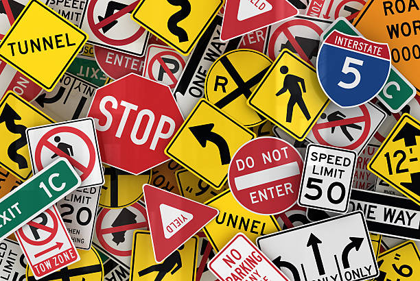 Assorted traffic sign wallpaper Many American traffic signs mixed together yield sign photos stock pictures, royalty-free photos & images