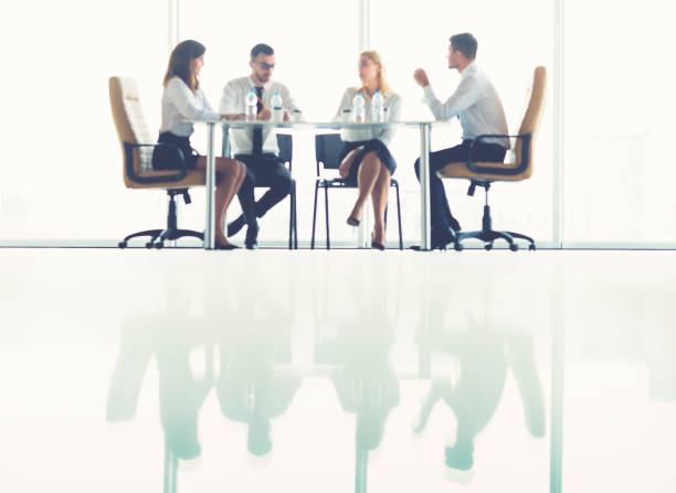 istock The four business people sit at the table on the conference 1144420533
