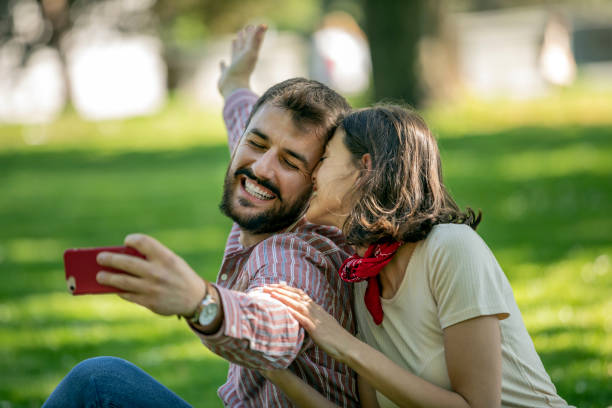 istock Young Attractive Couple is Having Fun in the Public Park 1144420625