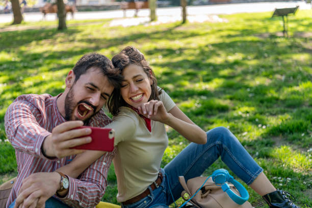 istock Young Attractive Couple is Having Fun in the Public Park 1144421073