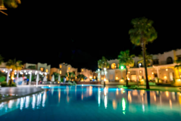istock Hotel interior with pool, palm trees in defocus 1144422692