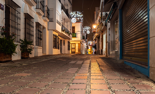 Empty night street of Marbella town, Andalusia, Spain