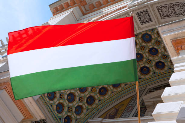 Hungary national flag waving on the wind. The flag of the Republic of Hungary is flying.