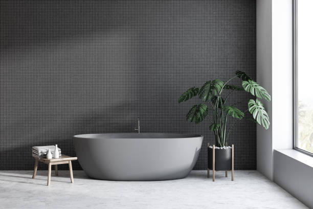 istock Black tile bathroom interior with gray tub 1144428127