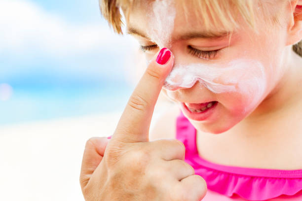 istock Mother applying sunscreen to child's face 1144428133
