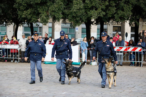 Rome, Italy - April 14, 2019: Piazza San Giovanni Bosco, policemen from the canine department with their police dogs, during a practical exercise with the public in the square.
