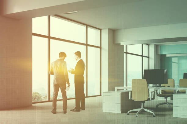 istock White and blue office workplace, people 1144428431