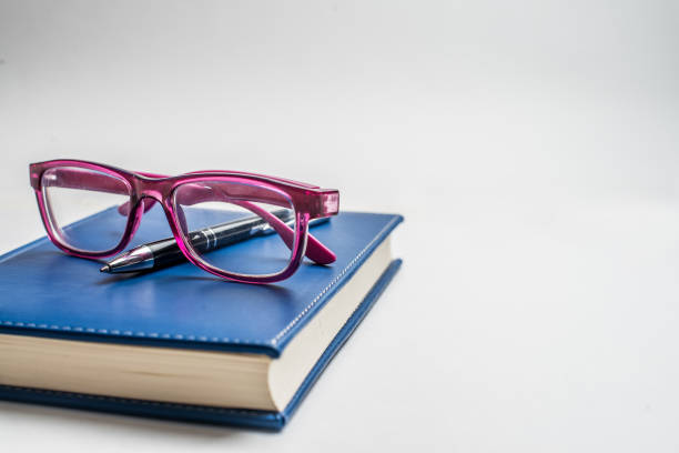 istock Notebook with glasses and pen, Book with glasses, Blue notebook with glasses, Book with cup of tea 1144428463