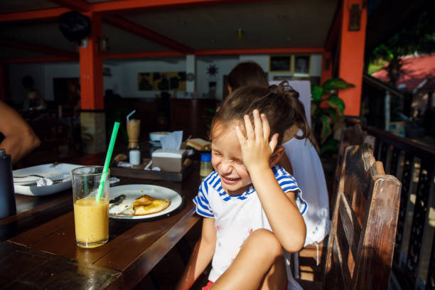 istock Little boy is on the breakfast in Thailand 1144428523