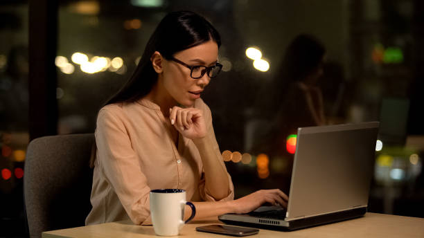 istock Female journalist typing article, cup of coffee on table, work inspiration 1144431570