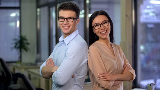 istock Cheerful employees posing for camera, work for young and energetic people, team 1144431621