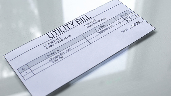 istock Utility bill lying on table, payment for services, month expenses, tariff 1144432093